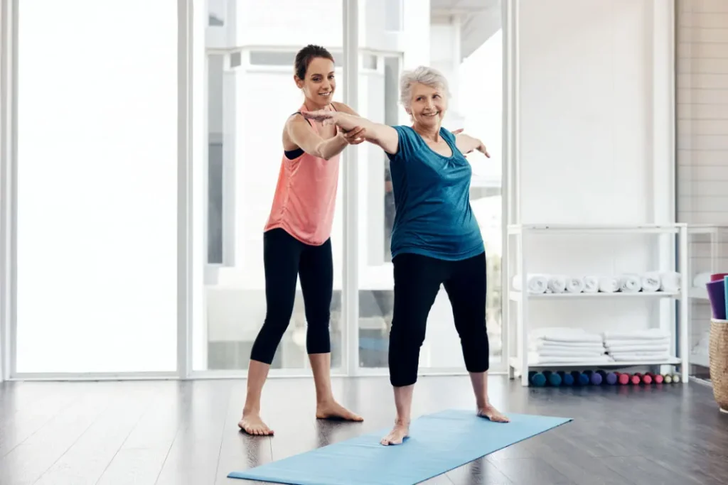 An old lady is doing exercise. 