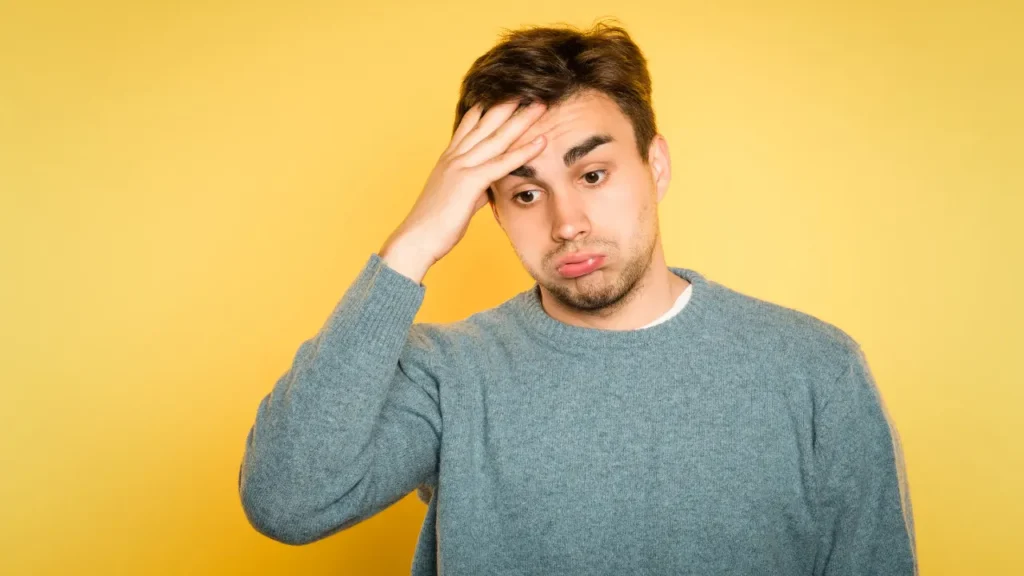 Young man feeling headache. 