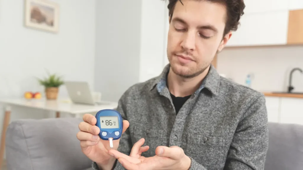 Man checking his blood sugar level. 