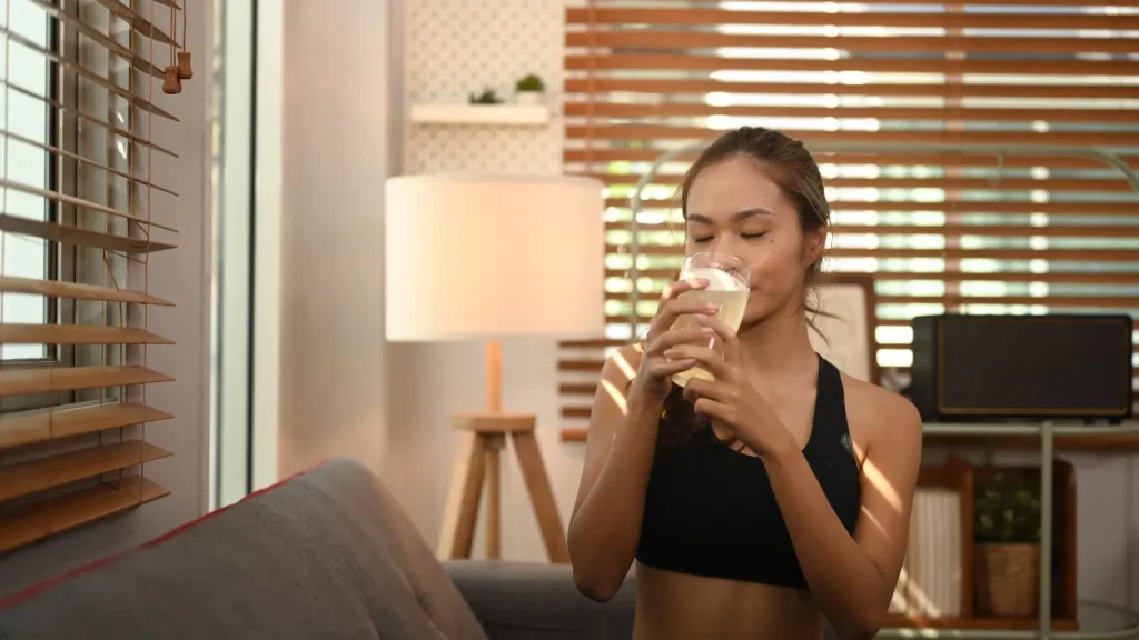 Lady having liquid supplements. 