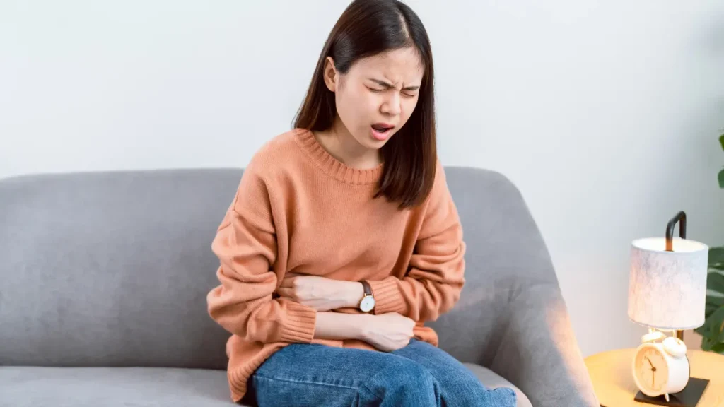 Young girl having belly pain. 