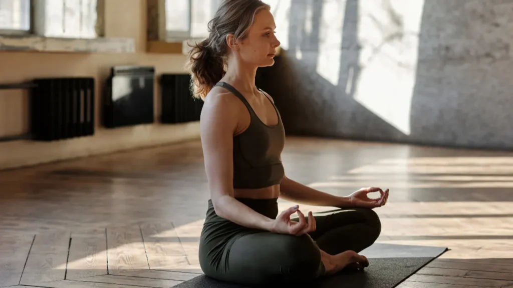 Lady is doing yoga.