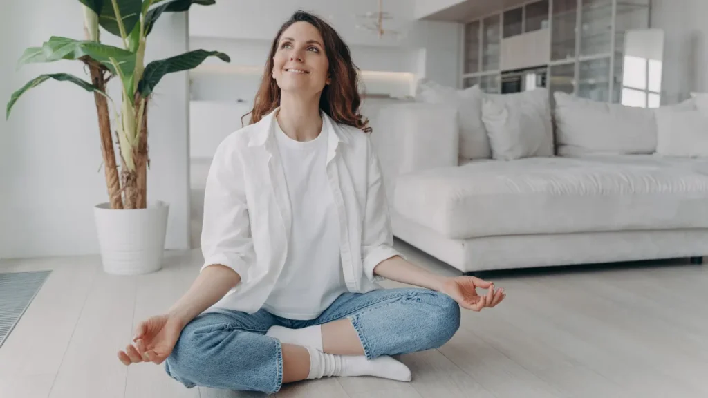 Lady is doing yoga. 