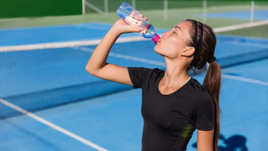 Lady is drinking water. 