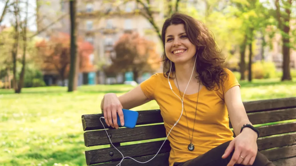 Lady is listening music. 