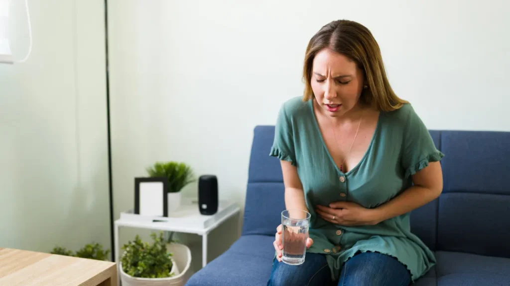 Lady having belly pain. 